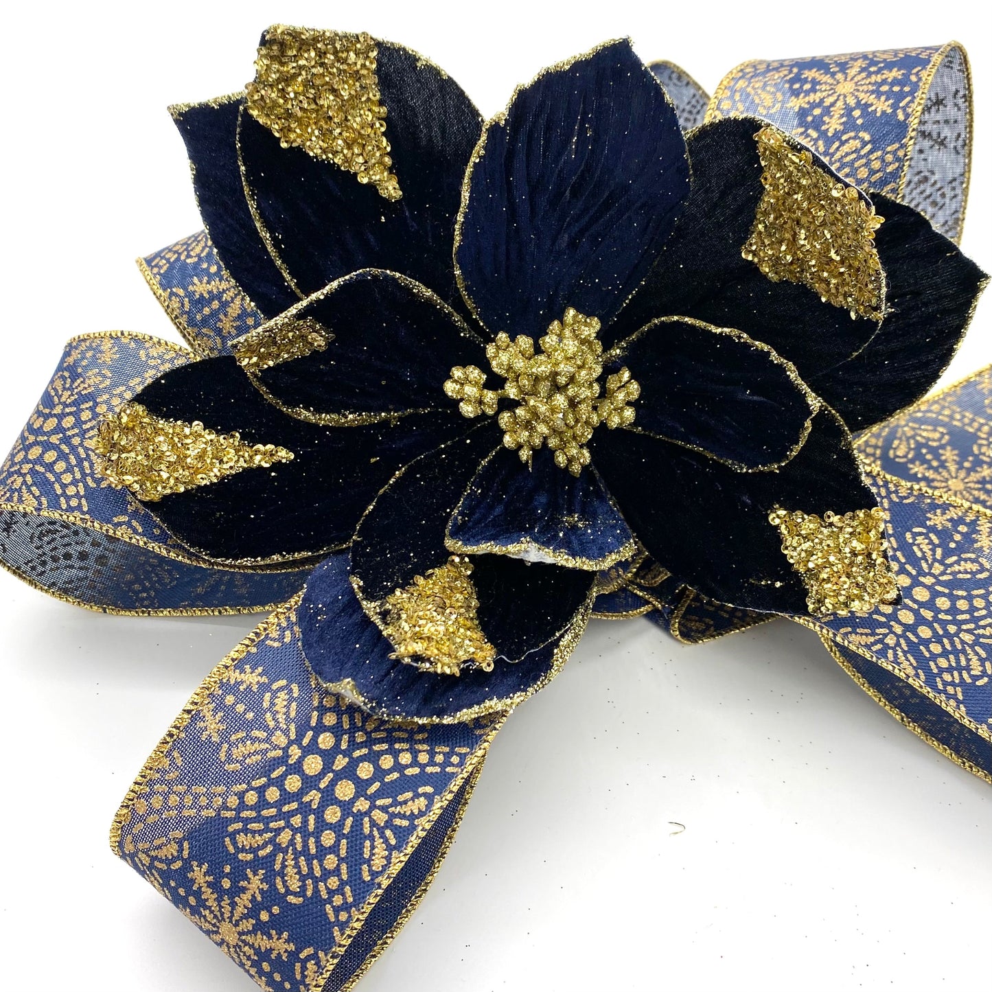 2.5" X 10 YARD GOLD SNOWFLAKE ON NAVY RIBBON